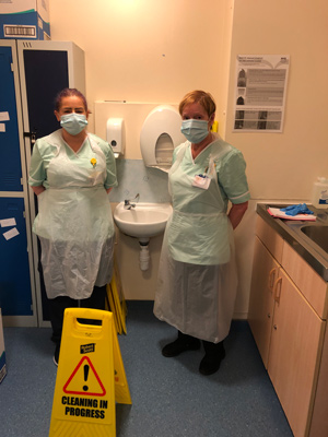 Two healthcare cleaning professionals providing reactive Covid-19 cleans in Langdon Hospital, Devon